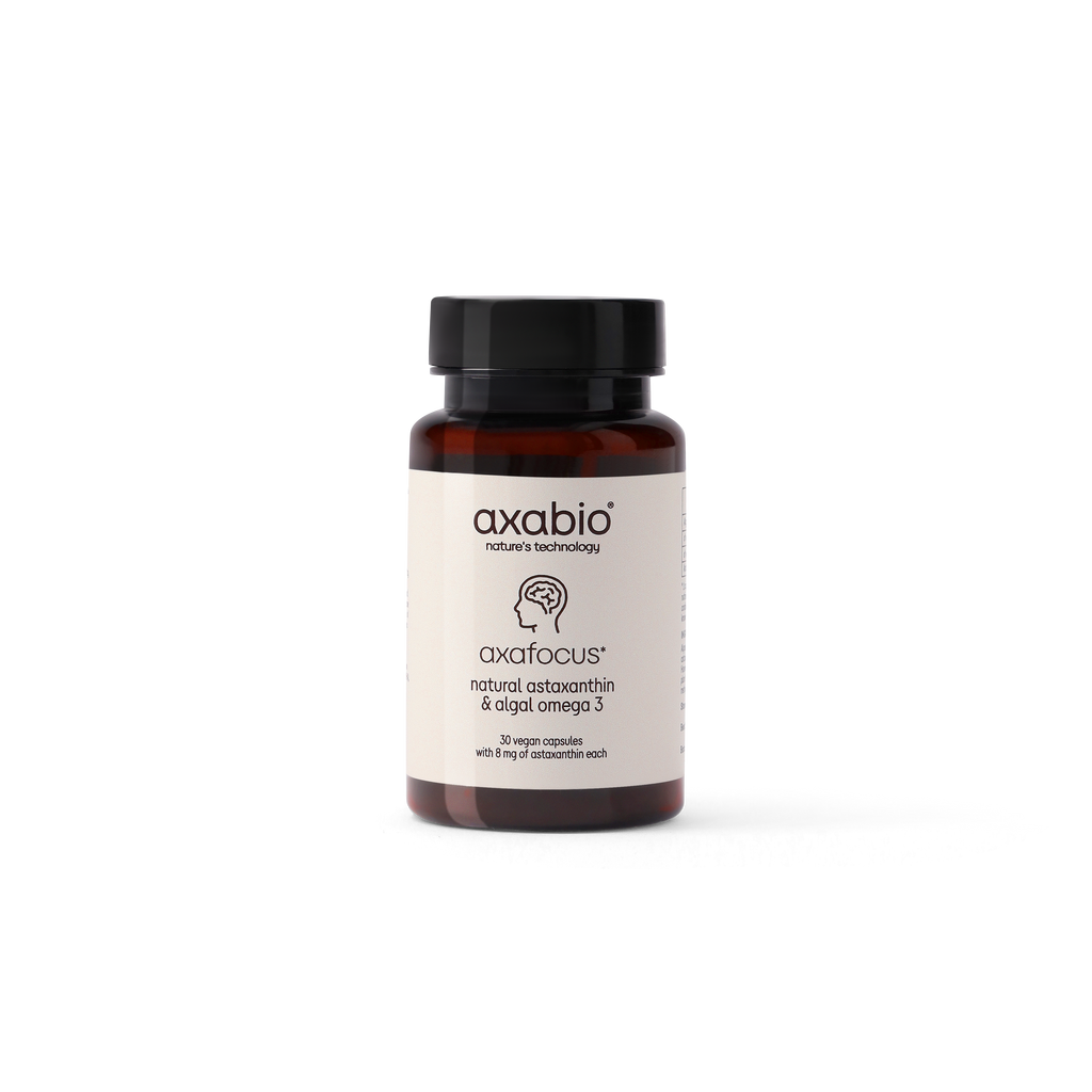 A single amber glass supplement bottle with a black cap and a white label reading 'axabio' and 'axafocus', centered on a plain white background.