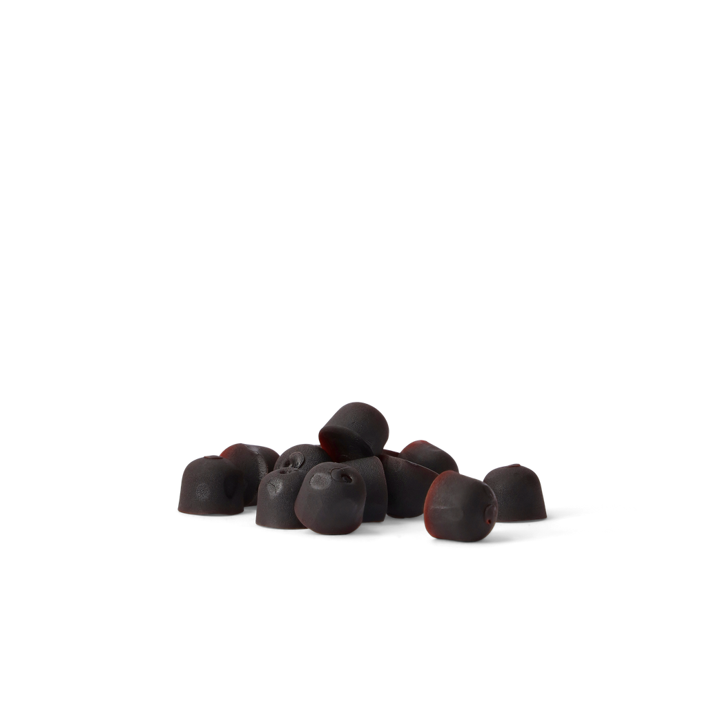A small pile of dark chocolate-covered gummy candies with red edges, arranged on a seamless white background.