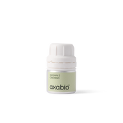 A small bottle of Axabio acrylic paint in the shade 'aperture 5 Ochrecream', featuring a pale green label and a white ribbed cap, set against a solid white background.